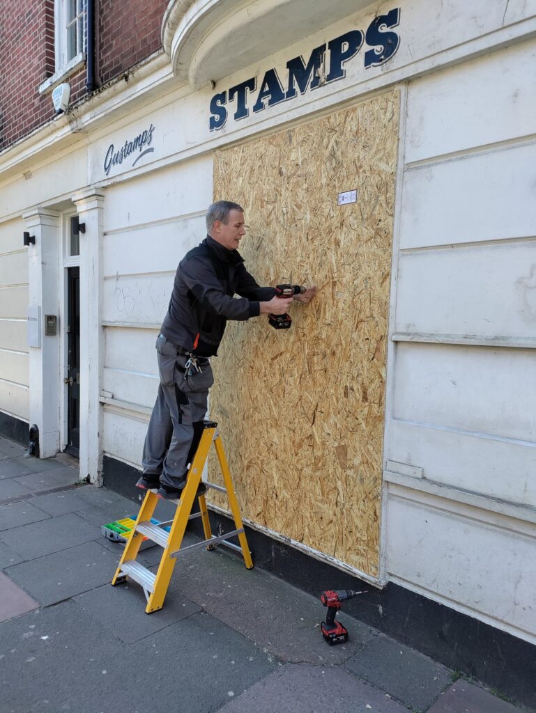 Window Boarding Up of Commercial Shop in Central Brighton