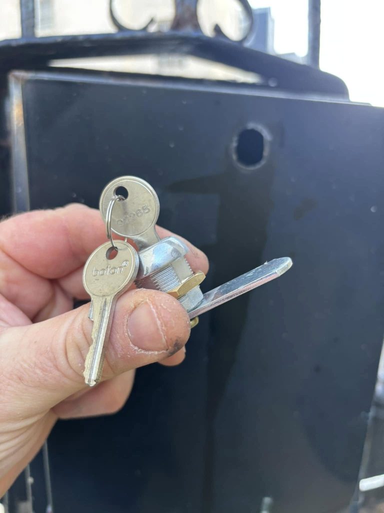Close up photo of a cam lock and keys 
