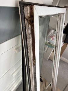 close up UPVC window repair hinge replacement